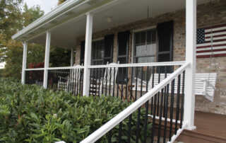 White Lincoln with Black Balusters with White Sentinel Aluminum Porch Posts