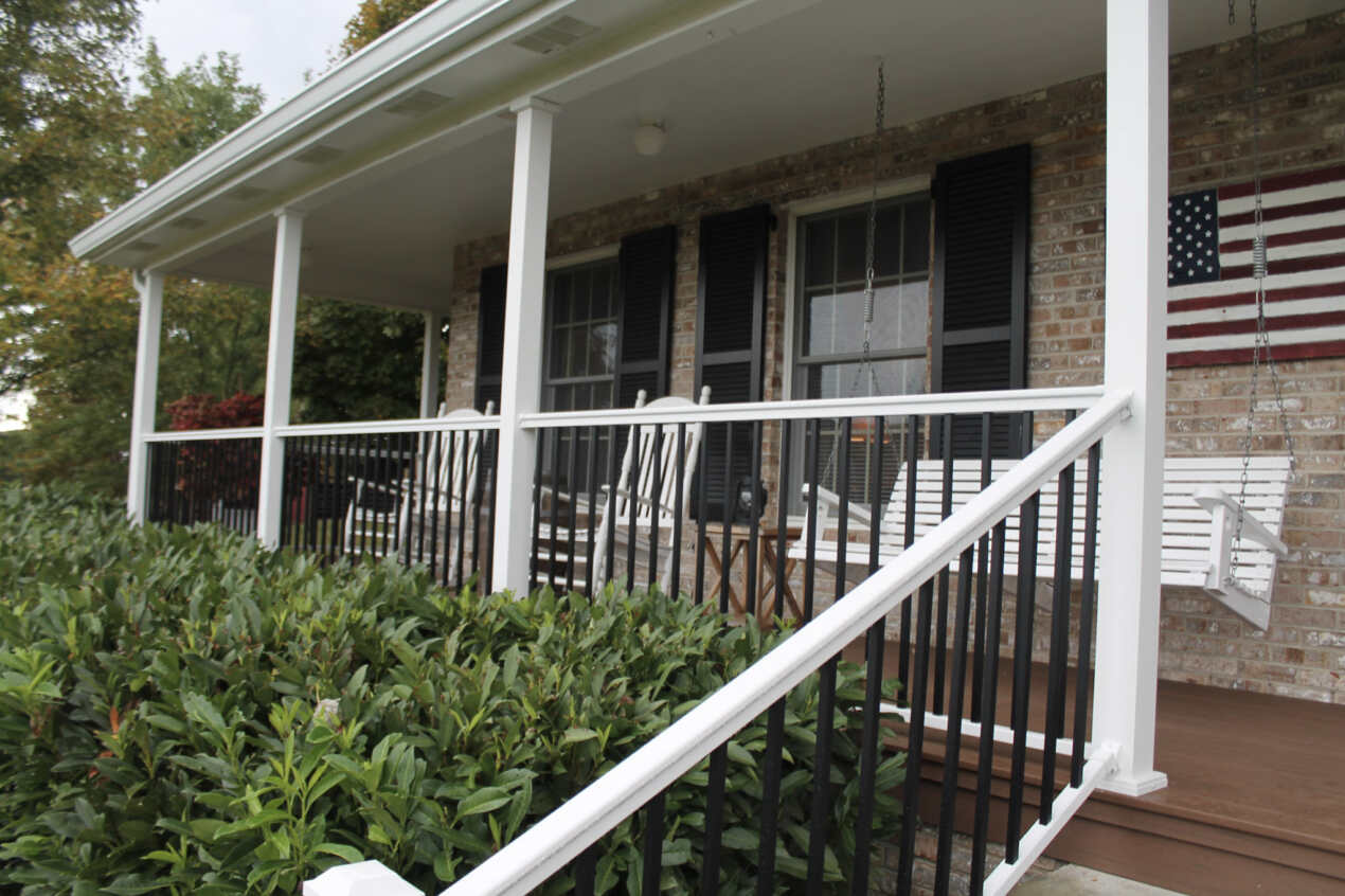 White Lincoln with Black Balusters with White Sentinel Aluminum Porch Posts