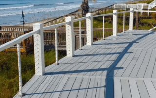 White Non-Routed Vinyl Railing and 6×6 Post Sleeves with a third-party cable rail system