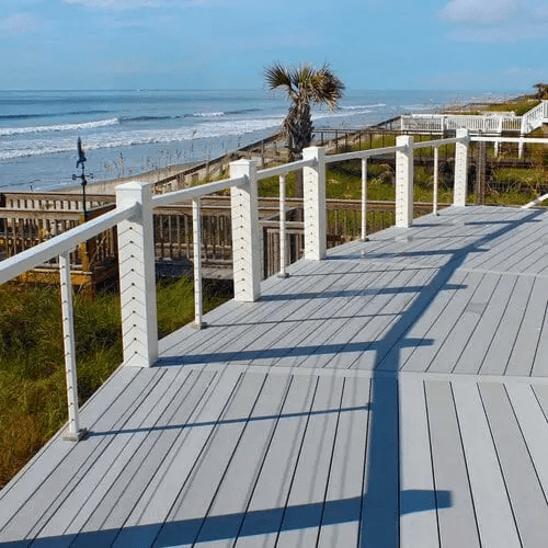 White Non-Routed Vinyl Railing and 6×6 Post Sleeves with a third-party cable rail system